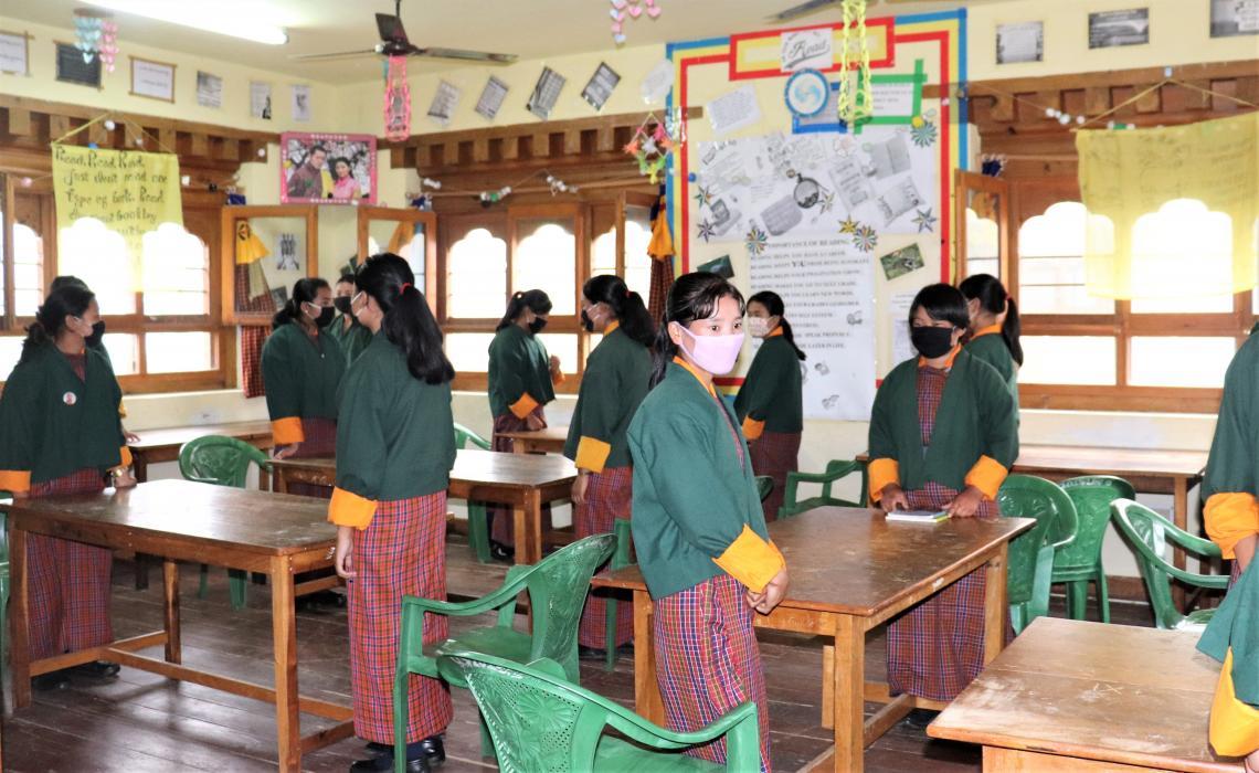 Girls students standing in their classroom