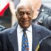Bill Cosby flanked by security men-GETTY IMAGE