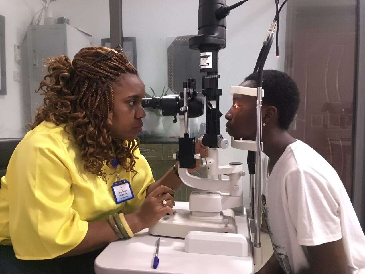 Dr. Chi Adisa with a patient