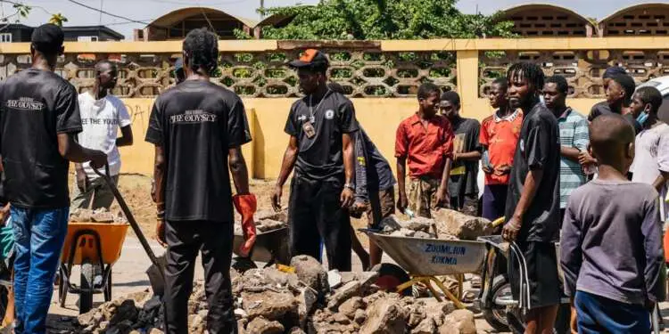 AratheJay leads community cleanup in Tema following "The Odyssey" release